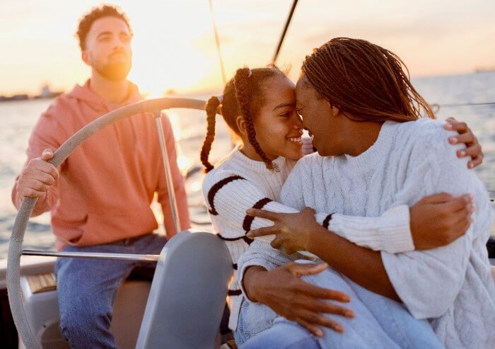 A happy family sailing in a marina bought from california yacht marina in Southern California