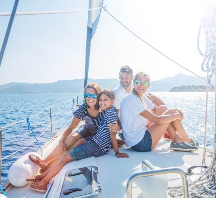 Happy Family sailing on a yacht in California